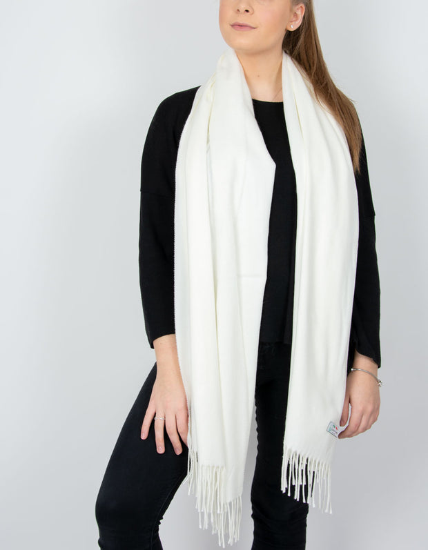 an image showing a cream blanket scarf