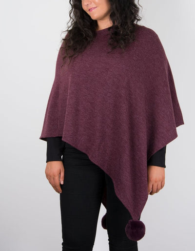 An image showing a poncho in burgundy