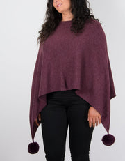 An image showing a poncho in burgundy