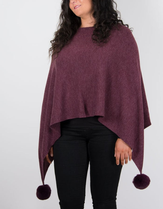 An image showing a poncho in burgundy