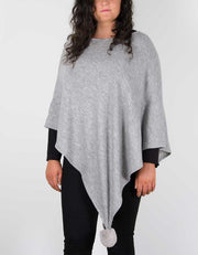 An image showing a light grey poncho