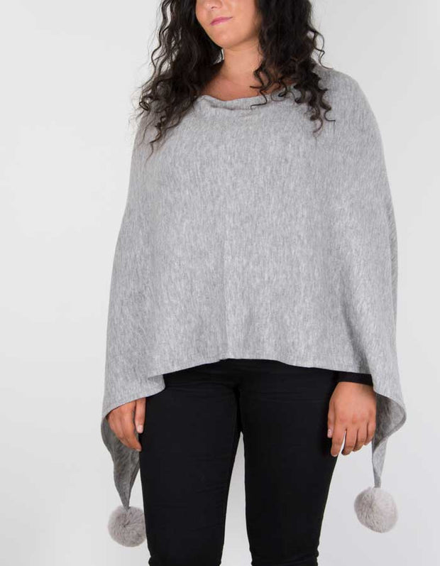 An image showing a light grey poncho