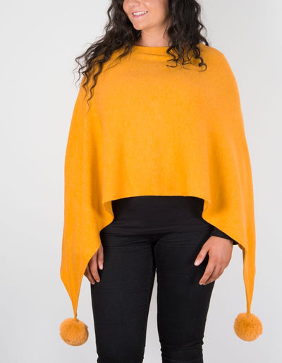 An image showing a mustard poncho