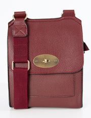 An image showing a wine coloured messenger bag.
