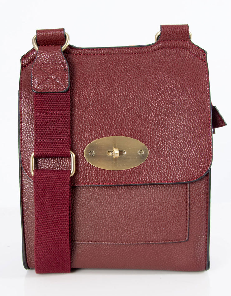 An image showing a wine coloured messenger bag.