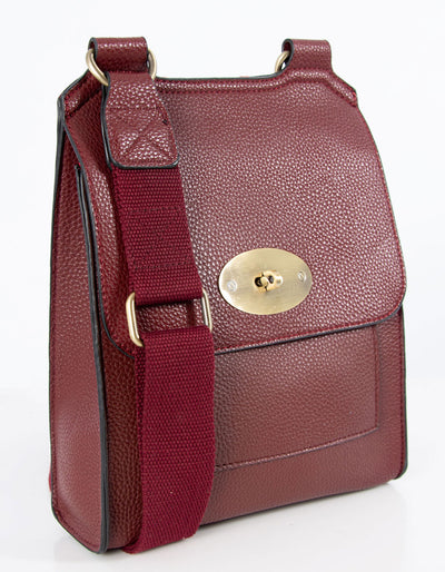 An image showing a wine coloured messenger bag.