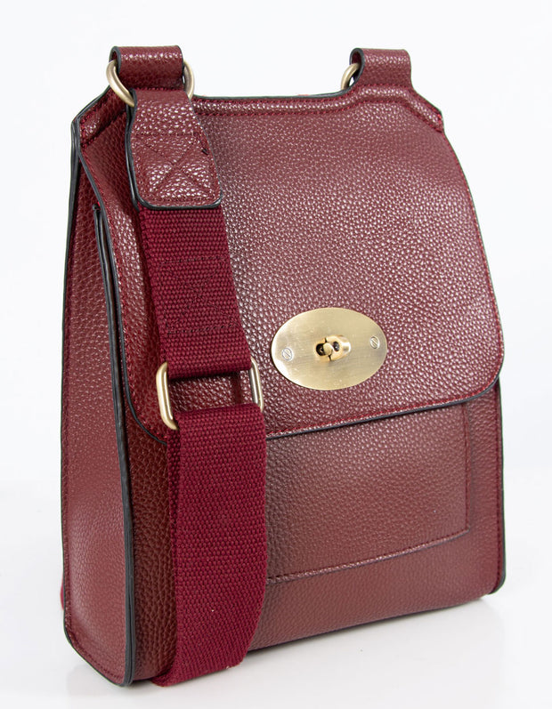 An image showing a wine coloured messenger bag.