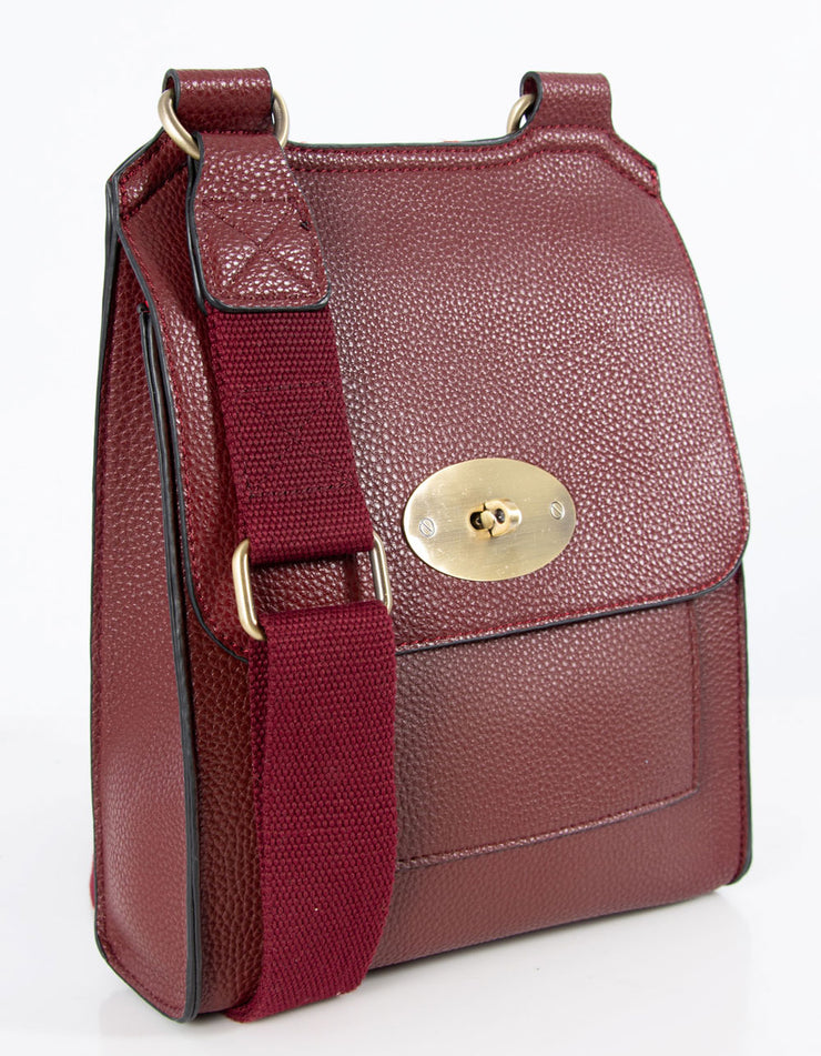 An image showing a wine coloured messenger bag.