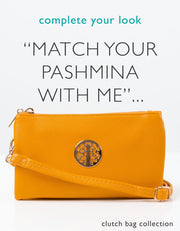 an image showing an amber yellow clutch bag