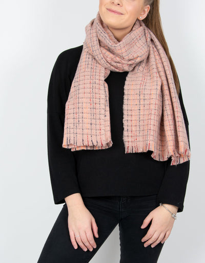 an image showing a pink blanket scarf