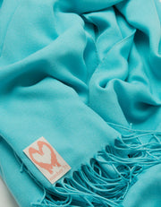 an image showing a close up of a blue pashmina in Aqua