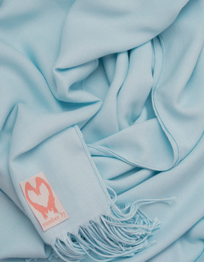 an image showing a close up of a pashmina in Baby blue