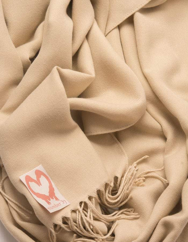 an image showing a close up of a pashmina in Biscuit brown