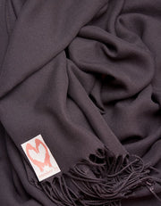 an image showing a close up of a pashmina in Dark Aubergine