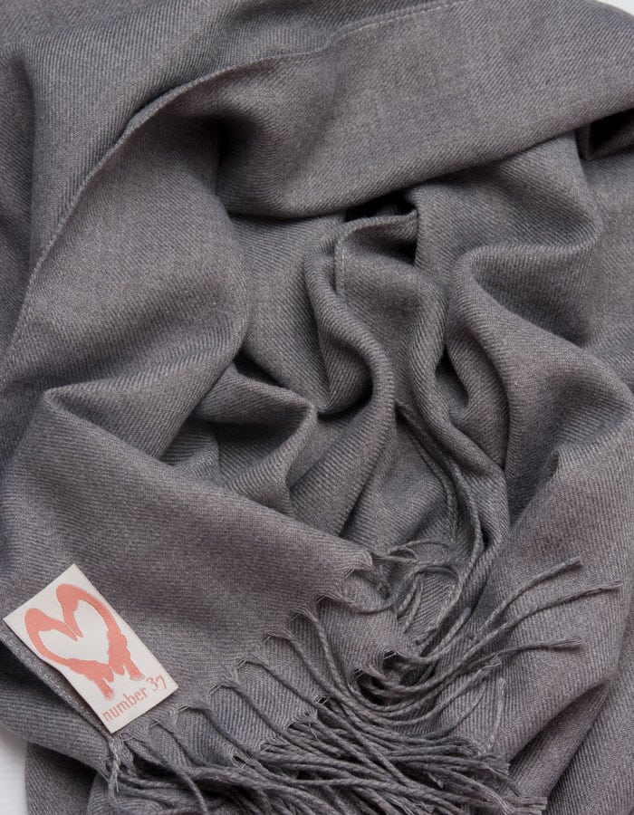 an image showing a close up of a pashmina in dark grey