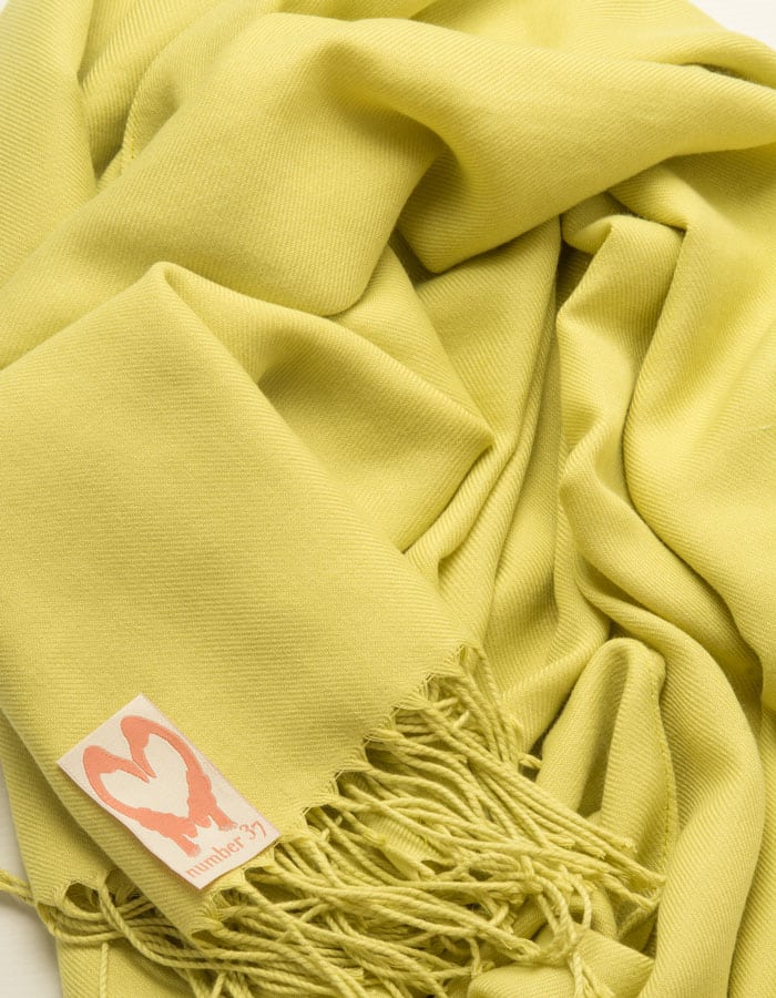 an image showing a close up of a pashmina in Lime Green