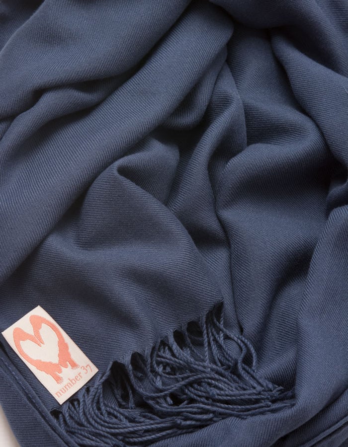 an image showing a close up of a pashmina in Moonlight Blue