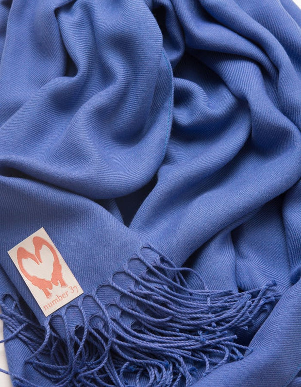 an image showing a close up of a pashmina in Royal Blue