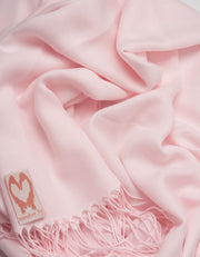 an image showing a close up of a pashmina in Petal Pink
