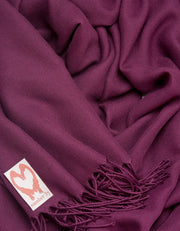 an image showing a close up of a pashmina in Plum Purple
