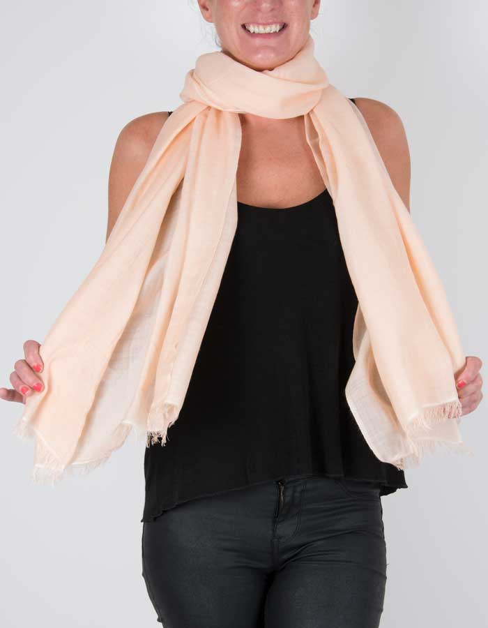 an image showing a wool silk mix pashmina in peach