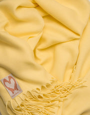 an image showing a close up of a pashmina in Yellow