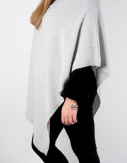 an image showing a grey poncho