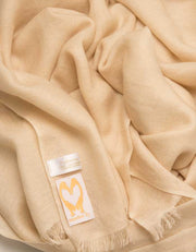 an image showing a pure cashmere pashmina scarf in cream