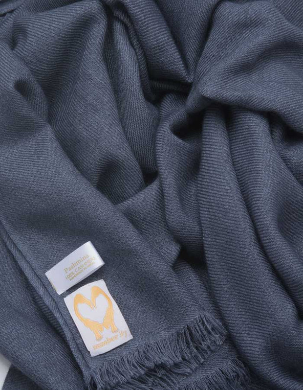 an image showing a pure cashmere pashmina scarf in dark grey
