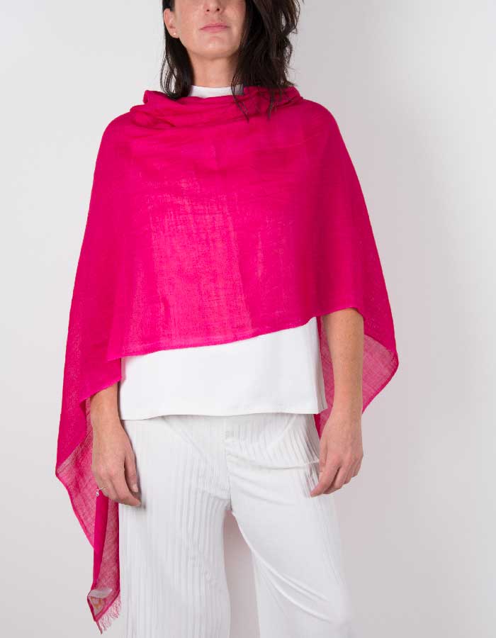 an image showing a silk wool mix wedding shawl in hot pink