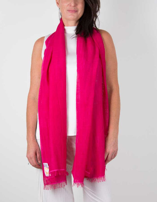 an image showing a silk wool mix wedding shawl in hot pink