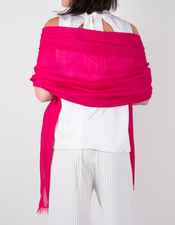 an image showing a silk wool mix wedding shawl in hot pink