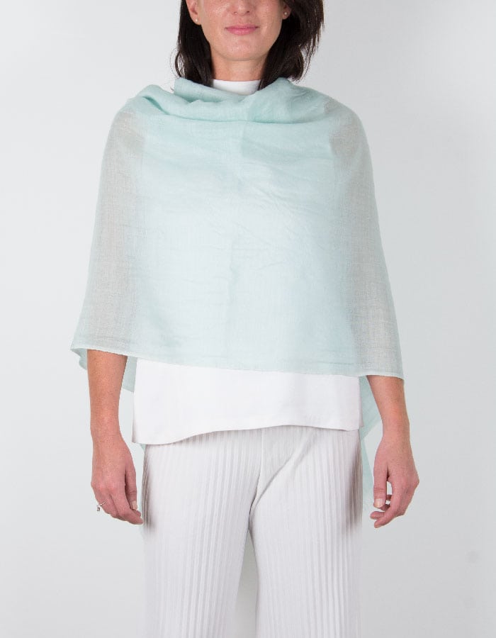 an image showing a silk wool mix wedding shawl in mint green