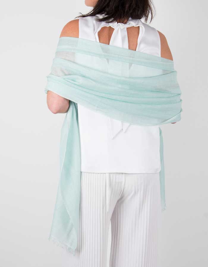 an image showing a silk wool mix wedding shawl in mint green