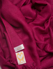 an image showing a pure cashmere pashmina scarf in mulberry