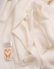 an image showing a pure cashmere pashmina scarf in white