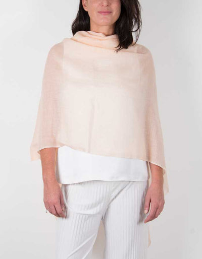 an image showing a silk wool mix wedding shawl in peach