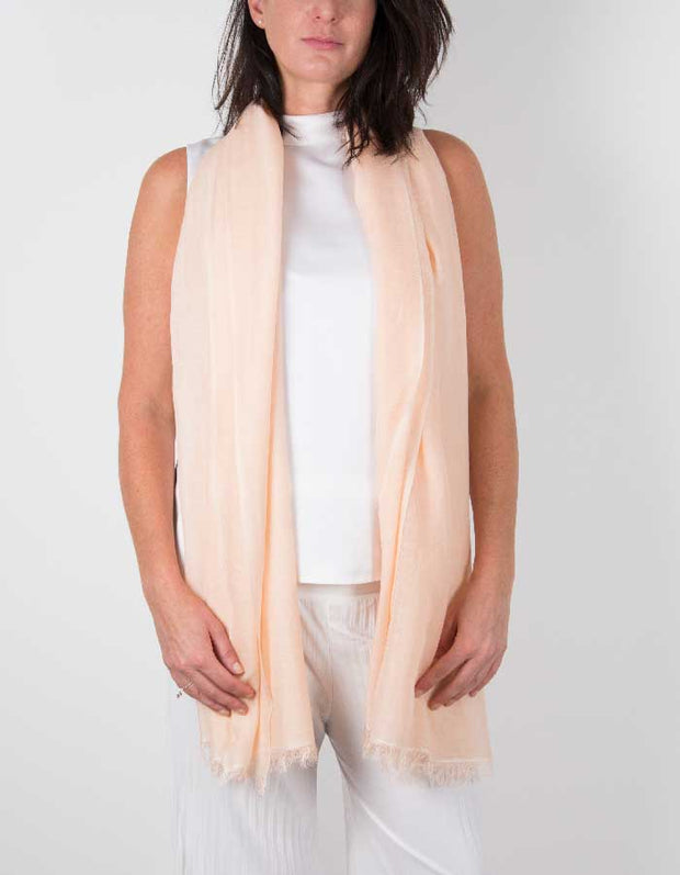 an image showing a silk wool mix wedding shawl in peach