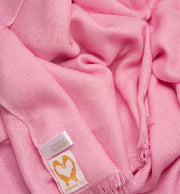 an image showing a pure cashmere wedding pashmina in Pink close up