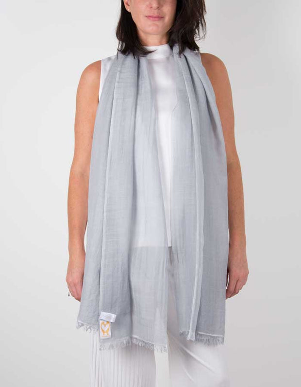 an image showing a silk wool mix wedding shawl in silver grey