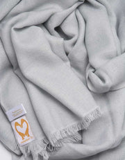 an image showing a pale grey pashmina scarf